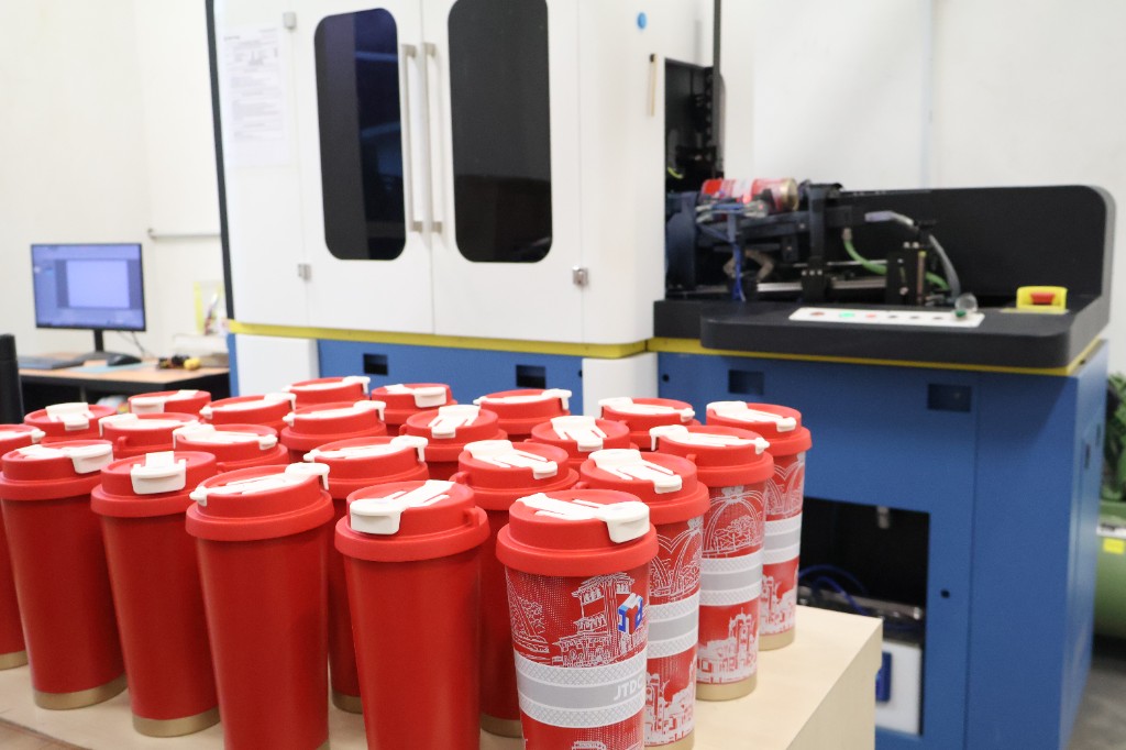 Wrap printing on cylindrical products